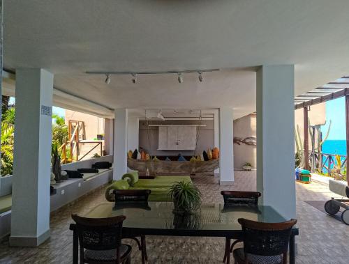 a living room with a table and a couch at Hotel Casa Barlovento in Los Naranjos