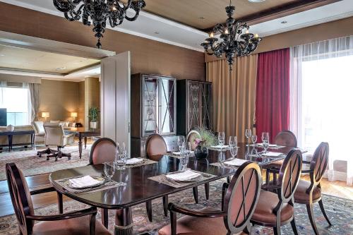 a dining room with a table and chairs at Grand Hotel River Park, a Luxury Collection Hotel, Bratislava in Bratislava
