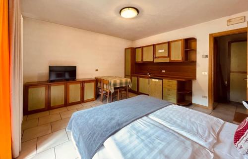 Кровать или кровати в номере Elga Residence - Relax in Alta Valtellina - Bormio
