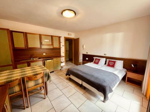 Кровать или кровати в номере Elga Residence - Relax in Alta Valtellina - Bormio