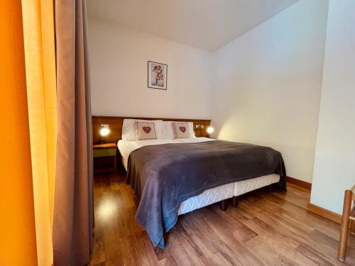 Кровать или кровати в номере Elga Residence - Relax in Alta Valtellina - Bormio