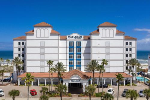 uma representação de um hotel com o oceano ao fundo em Four Points by Sheraton Jacksonville Beachfront em Jacksonville Beach