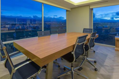 a conference room with a large wooden table and chairs at Sheraton San Jose Hotel, Costa Rica in San José