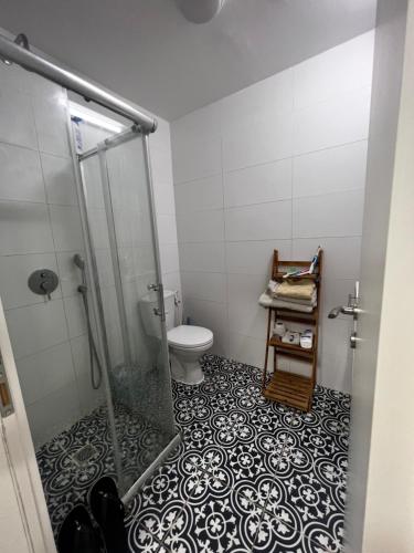 a bathroom with a shower and a toilet at דירה מדהימה קטנטנה תאהבו אותה ، A small, beautiful and comfortable apartment, you will love in Haifa
