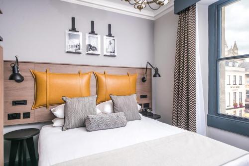 a bedroom with a large bed and a window at Abbey Hotel Bath, a Tribute Portfolio Hotel in Bath