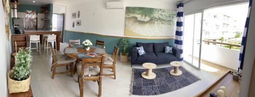 a living room with a couch and a table at Nuevo y Muy Bonito Departamento Con Vista a la Alberca - Residencial Almarena I in Mazatlán