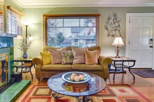 a living room with a couch and a table at Walk to Williams District Home with Hot Tub and Patio in Portland