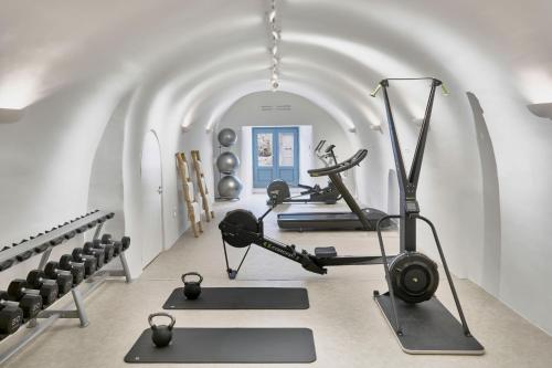 a gym with cardio machines and exercise bikes at Vedema, a Luxury Collection Resort, Santorini in Megalokhori