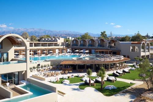 an aerial view of a hotel with a swimming pool at Domes Noruz Chania, Autograph Collection- Adults Only in Kato Daratso
