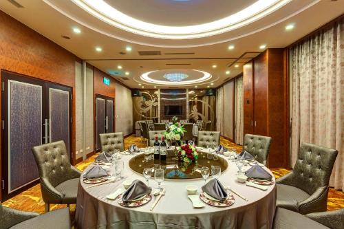 a meeting room with a large table and chairs at Golden Tulip - Aesthetics in Zhunan