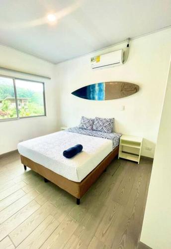 a bedroom with a bed in a room at Pacific Breeze House - with private pool in Jacó