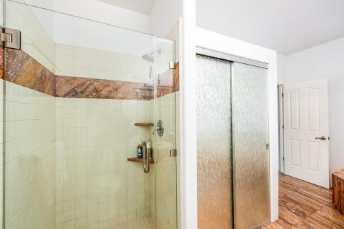a shower with a glass door in a bathroom at WEST SEDONA RETREAT w/ VIEWS of Coffee Pot Rock! in Sedona