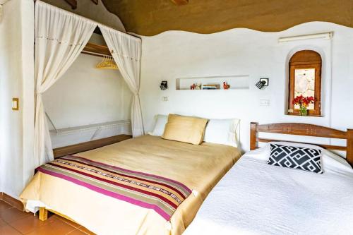Ένα ή περισσότερα κρεβάτια σε δωμάτιο στο Casa Guapurú