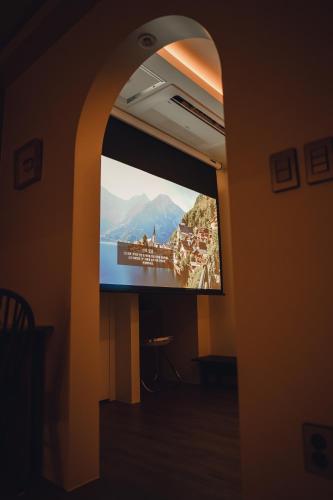 a flat screen tv sitting in a room with a tv at Gyeong-ju Stayangim in Gyeongju