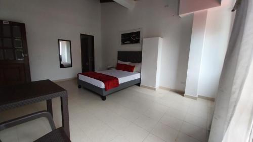Katil atau katil-katil dalam bilik di Hotel Ayenda La 44 Norte