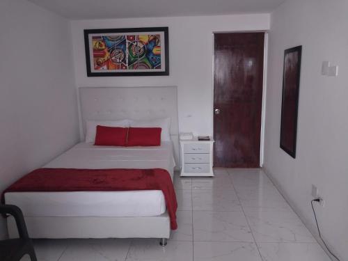 Katil atau katil-katil dalam bilik di Hotel Ayenda La 44 Norte