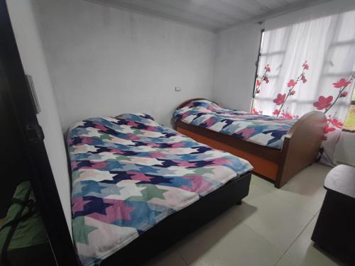 Кровать или кровати в номере Casa campo vista a las montañas