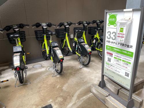 a bunch of bikes are lined up in a garage at HOTEL AMANEK Kanazawa in Kanazawa