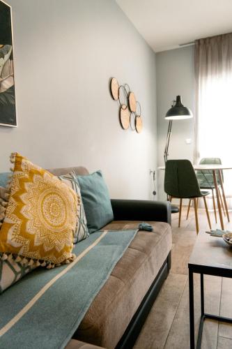 a living room with a couch and a table at Centro Alexandroupolis in Alexandroupoli