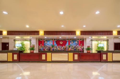Ο χώρος του λόμπι ή της ρεσεψιόν στο Grand Metropark Hotel Shandong