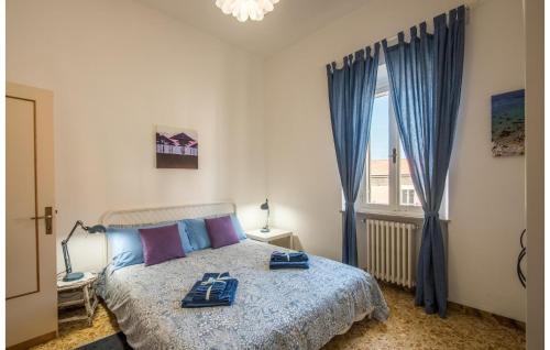 a bedroom with a bed with two dishes on it at Beautiful Apartment In Monte San Savino With 2 Bedrooms And Wifi in Monte San Savino