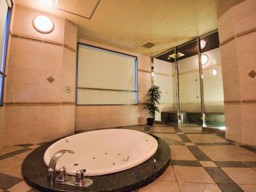 a large bathroom with a large tub in a room at K2 SKY Resort Itoshima Love Hotel in Itoshima
