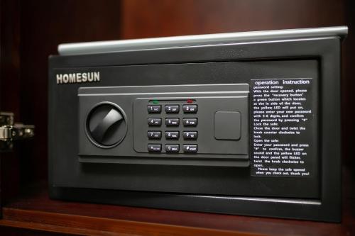 a microwave oven sitting on top of a wooden table at Salute Premium Hotel & Spa in Hanoi