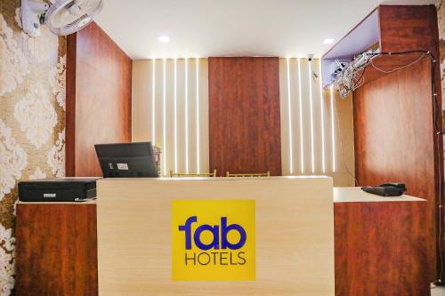 an office with a ibid h hotels sign on a desk at FabHotel Cosmos in Allahābād