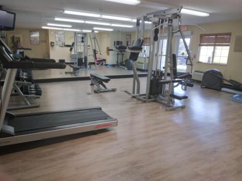 a gym with several treadmills and exercise machines at Candlewood Suites Harrisburg I-81 Hershey Area by IHG in Harrisburg