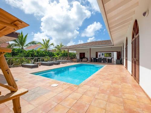 an image of a swimming pool in a house at Holiday villa at Jan Thielstrand in Willemstad in Jan Thiel