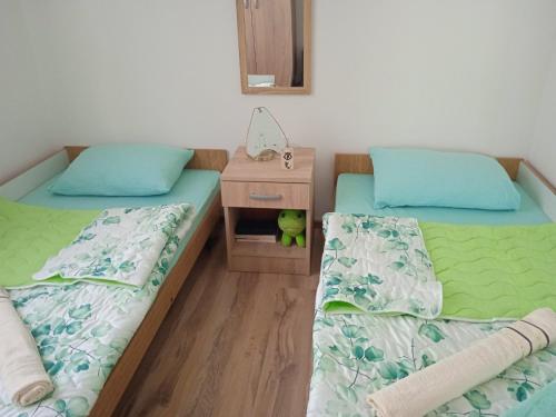 Postel nebo postele na pokoji v ubytování Oaza Kumbor