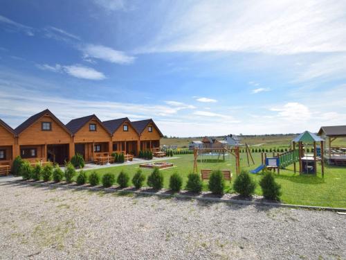 a playground at a lodge with a playground at Nice holiday home located 800 m from the sea in Mielenko