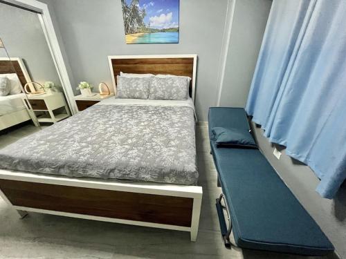 a bedroom with a bed and a bench in it at Waikiki Condo 2 Bedrooms 2 Bathrooms with 1 free parking space in Honolulu
