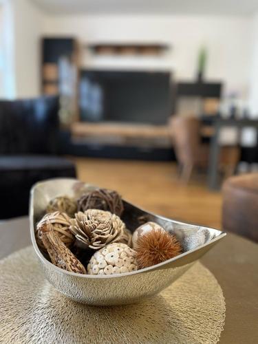 a bowl filled with different types of mushrooms on a table at Ferienwohnung Via Callidus in Xanten