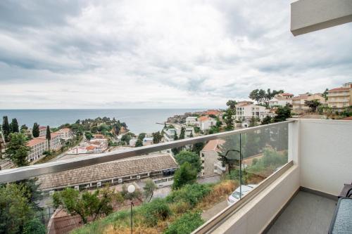 a balcony with a view of the ocean at CASA BIANCA & Spa 2 in Ulcinj