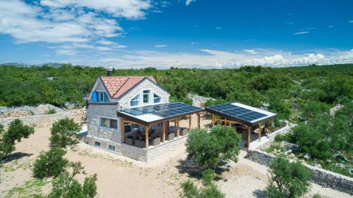 an aerial view of a house with solar panels on it at Villa Maris in Betina