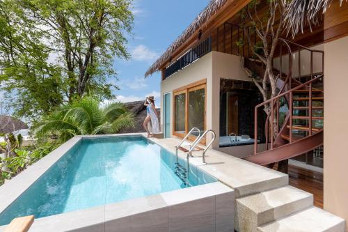 a swimming pool in front of a house at Irene Pool Villa Resort, Koh Lipe in Ko Lipe