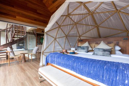 a bedroom with a bed in a tent at Irene Pool Villa Resort, Koh Lipe in Ko Lipe