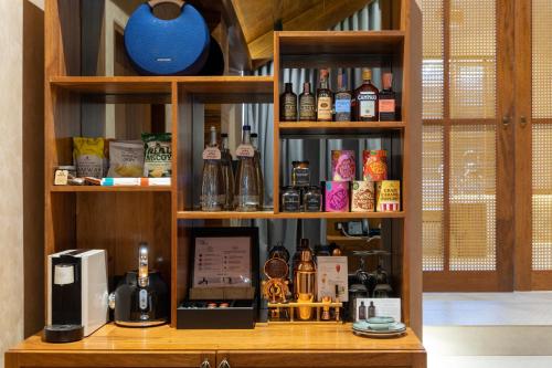 a shelf filled with lots of bottles of alcohol at Irene Pool Villa Resort, Koh Lipe in Ko Lipe