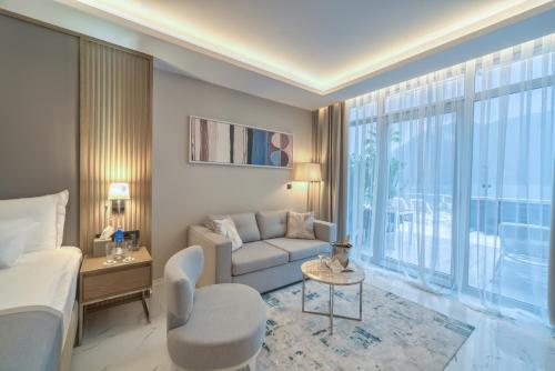 a hotel room with a bed and a couch at Hyatt Regency Kotor Bay Resort in Kotor