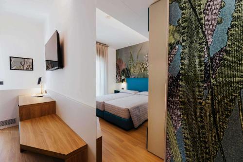 Postel nebo postele na pokoji v ubytování Hotel La Serena