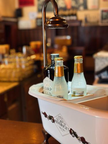 two bottles of beer sitting in a sink at Lexenhof in Nussdorf am Attersee