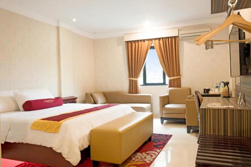 Postel nebo postele na pokoji v ubytování BI Executive Hotel
