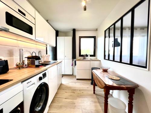 Köök või kööginurk majutusasutuses T2 parking/climatisation - proche Halles au grain