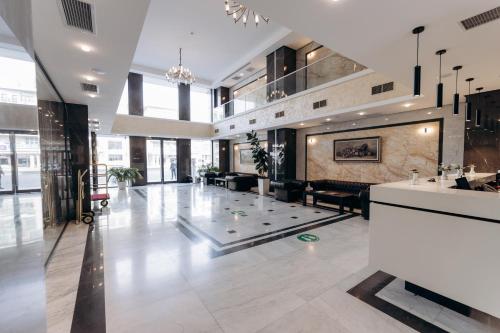 a lobby of a building with a reception desk at The Diamond Hotel Baku in Baku