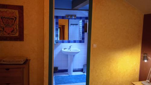 a bathroom with a sink and a mirror at Le Mas Franc in Enveitg