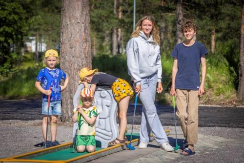 a group of people standing in front of a sign at Camp Gielas, Arvidsjaur in Arvidsjaur