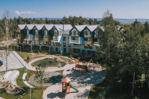 an aerial view of a building with a playground at Apartmán Breeze in Stará Lesná