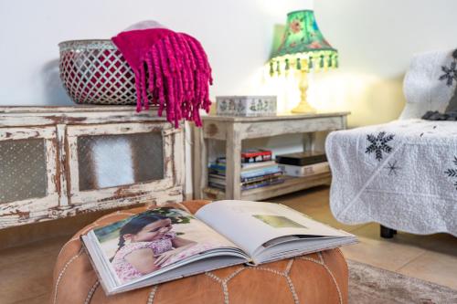 an open book sitting on top of a coffee table at Suite Kolibri in Galilee in Semadar