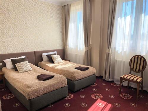 Hotel President tesisinde bir odada yatak veya yataklar